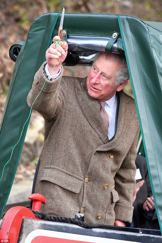 Charles animatedly waved around a pair of gold scissors which he used to cut the ceremonial ribben to reopen the newly restored canal