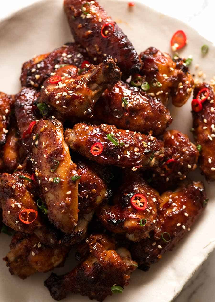 Sticky Chinese Chicken Wings on a plate, ready to be eaten 